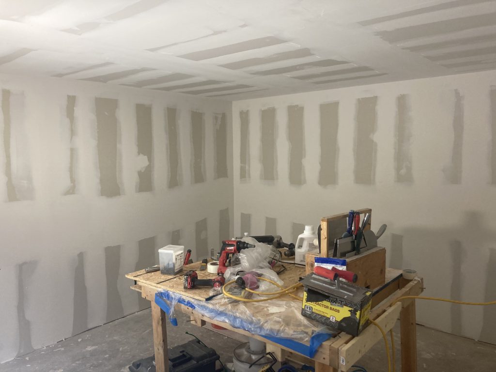 Basement family room drywall taken to a level 4 finish