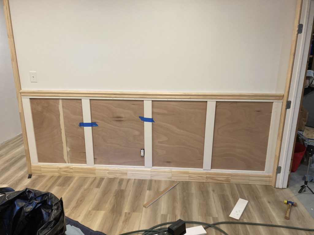 Wainscoting being built out on the basement office wall