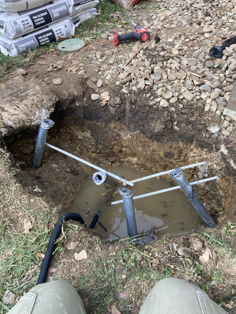 Excavated pier hole with rebar cage set before the concrete pour