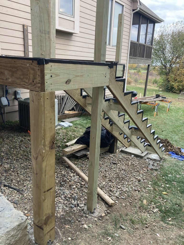 New stair stringer framing with joist hangers and blocking
