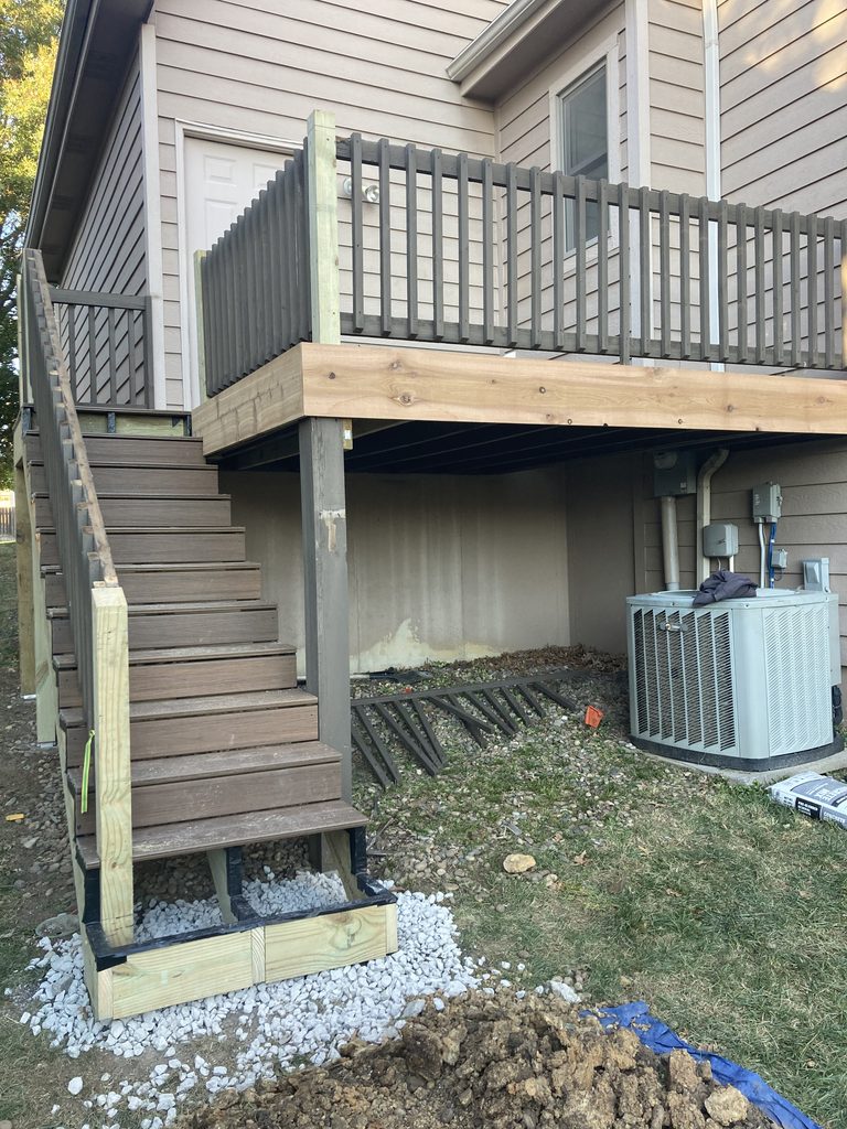 New deck railing and composite stair treads under construction