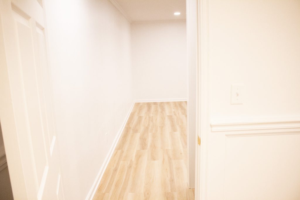 Finished basement family room, second view