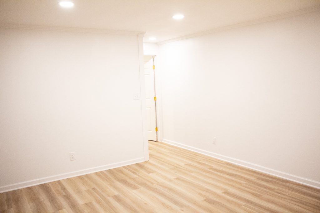Finished basement family room looking toward the doorway