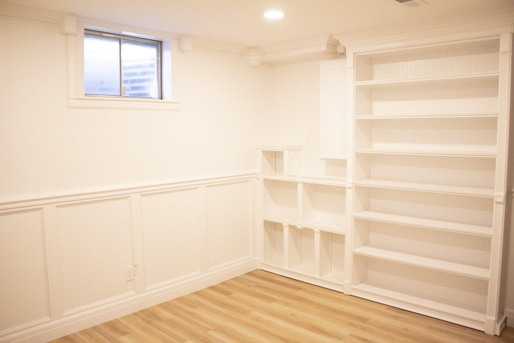 Finished built-in bookcase alongside the office window