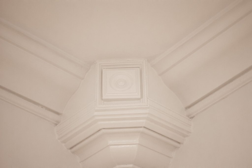 Finished crown moulding and wainscoting box detail