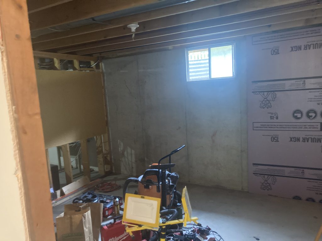 Unfinished basement office room before renovation began