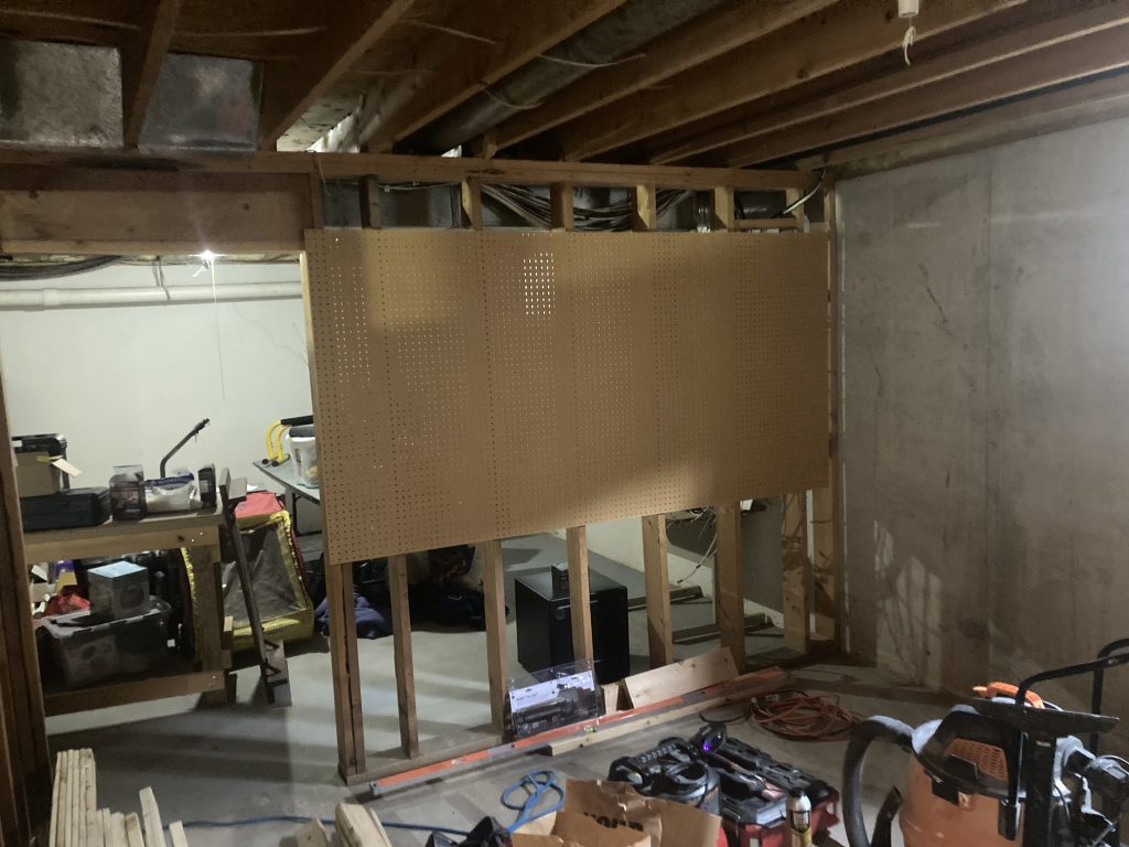 Second view of the unfinished basement office room before work began