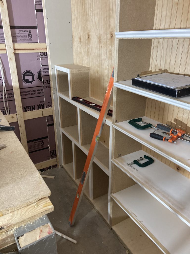 Cabinet for the water main valve built off site at the shop to a design worked out with the homeowner