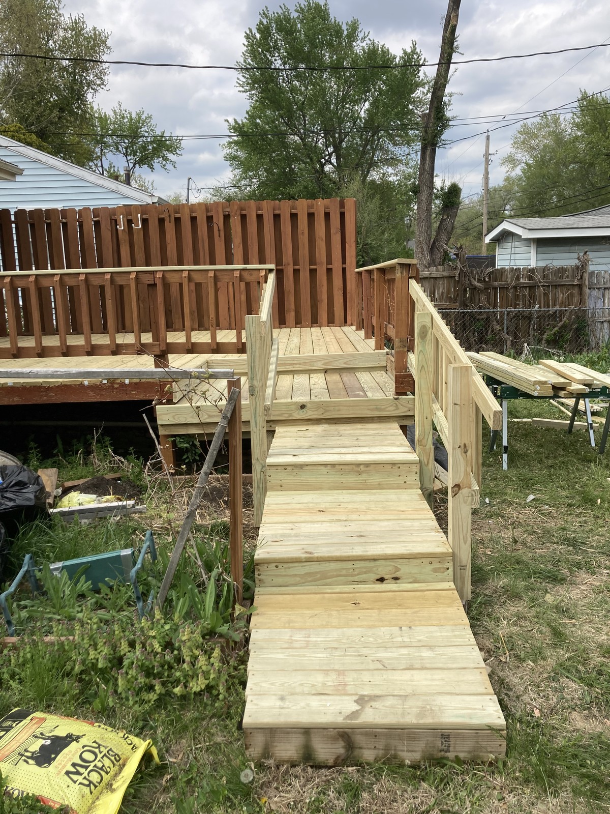 Finished ramp and steps leading up to the deck, viewed from the yard