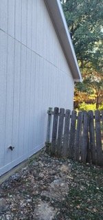 Completed side wall with new siding repair along full length
