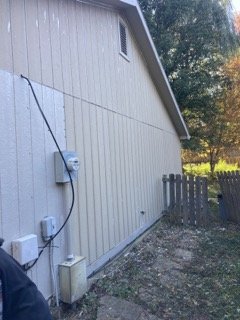 New siding panels installed on wall section