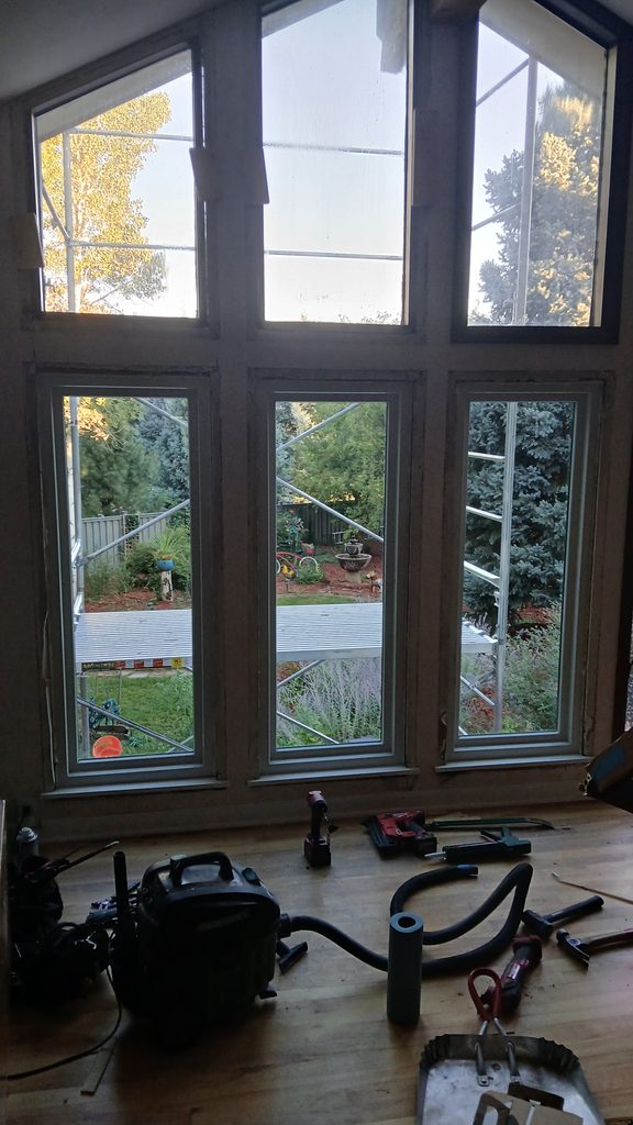 Interior of the window wall mid-project, new windows in with trim not yet installed.