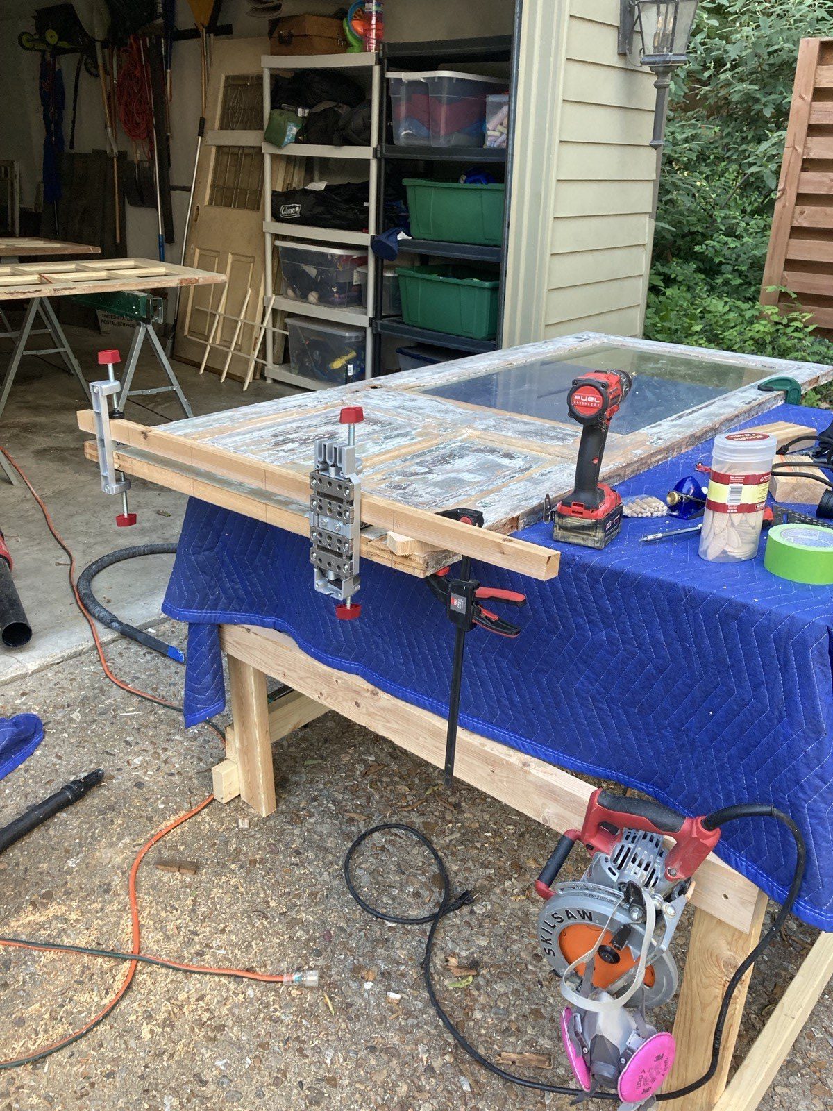 New bottom rail in bar clamps being glued into place on worktable